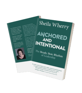 Two copies of the book "Anchored and Intentional: The Steady, Stoic Rhythm of Leadership" by Sheila Wherry, one showing the front cover and the other showing the back cover with author photo and summary text.
