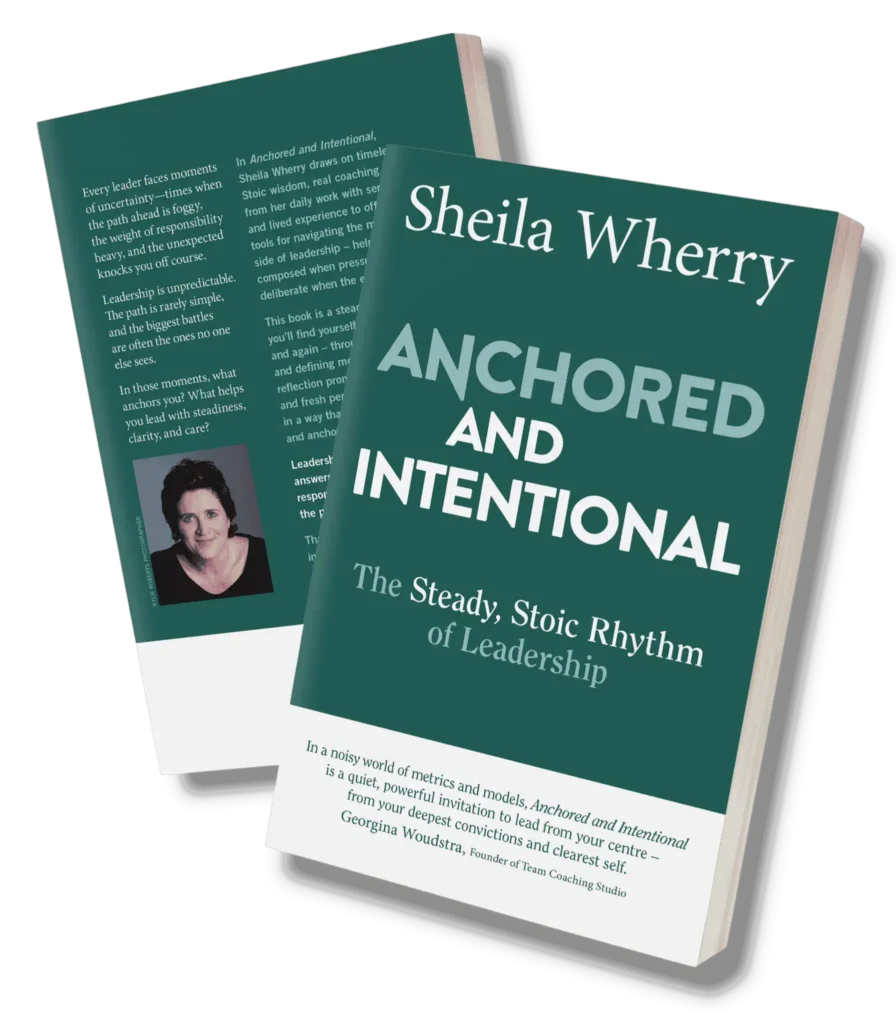 Anchored and Intentional, Two copies of the book "Anchored and Intentional: The Steady, Stoic Rhythm of Leadership" by Sheila Wherry, one showing the front cover and the other showing the back cover with author photo and summary text.
